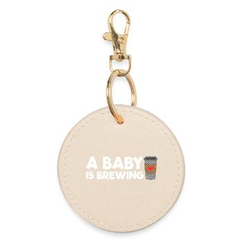 An expectant mother whose baby is brewing coffee - Round Keyring - oyster - Front