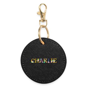 CHARLIE name adorned with flowers - Round Keyring - black - Front