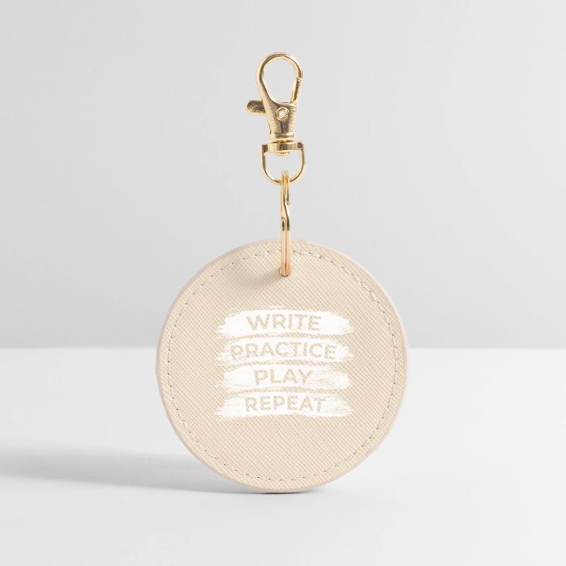 Writing, practicing, playing, repeating Round Keyring
