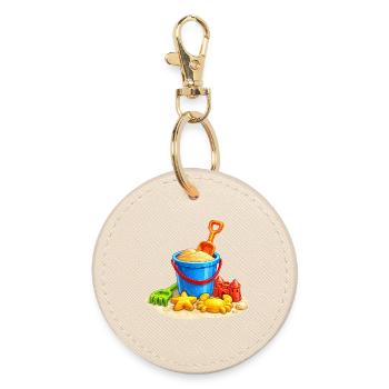Strandspielzeug im Sand am Meer  - Runder Schlüsselanhänger - Auster - Vorne