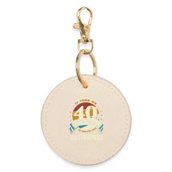 40 Years of Masterpiece Anniversary - Round Keyring - oyster - Front