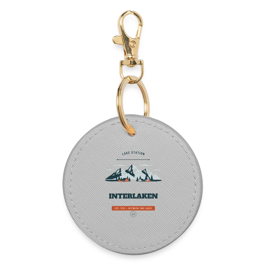 Interlaken badge on a round keyring, grey