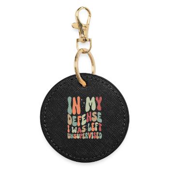 In my Defense I was left unsupervised - Round Keyring - black - Front