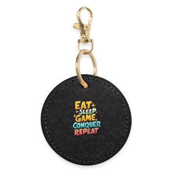 EAT, SLEEP, GAME, CONQUER, REPEAT - Round Keyring - black - Front