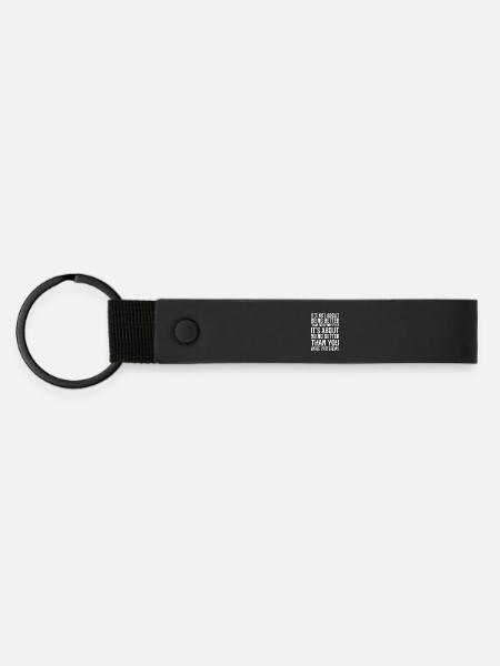 It's not about being better than someone else - Matte Pu Keyring - black