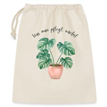 Monstera Aquarell – „Was man pflegt, wächst“ - Geschenkbeutel aus Baumwolle (40 x 50 cm) - Natur - Vorne