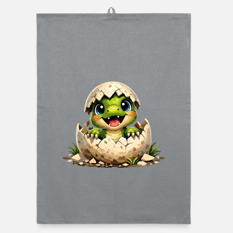 Un petit dinosaure mignon éclot de l’œuf Torchon bio