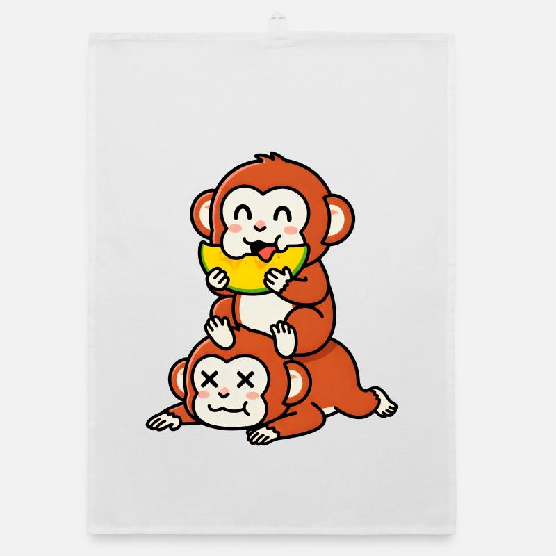 Singe espiègle mangeant de la pastèque sur un ami Torchon bio