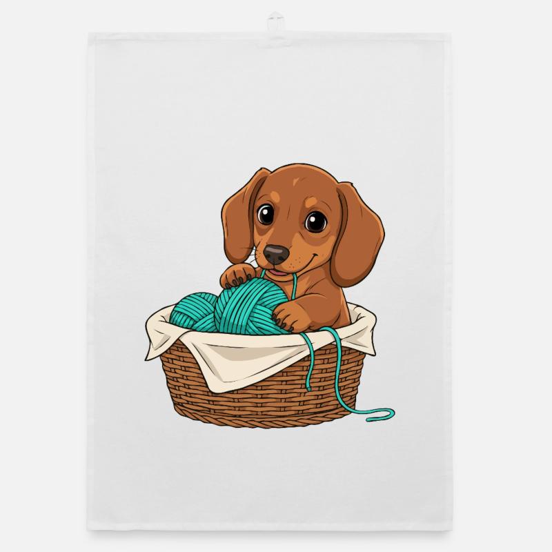 Chiot teckel dans un panier Torchon bio