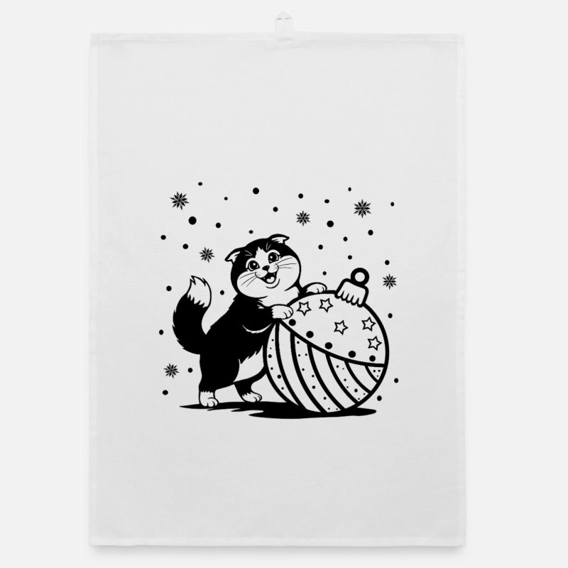 Chat mignon et duveteux avec une grosse babiole de Noël Torchon bio