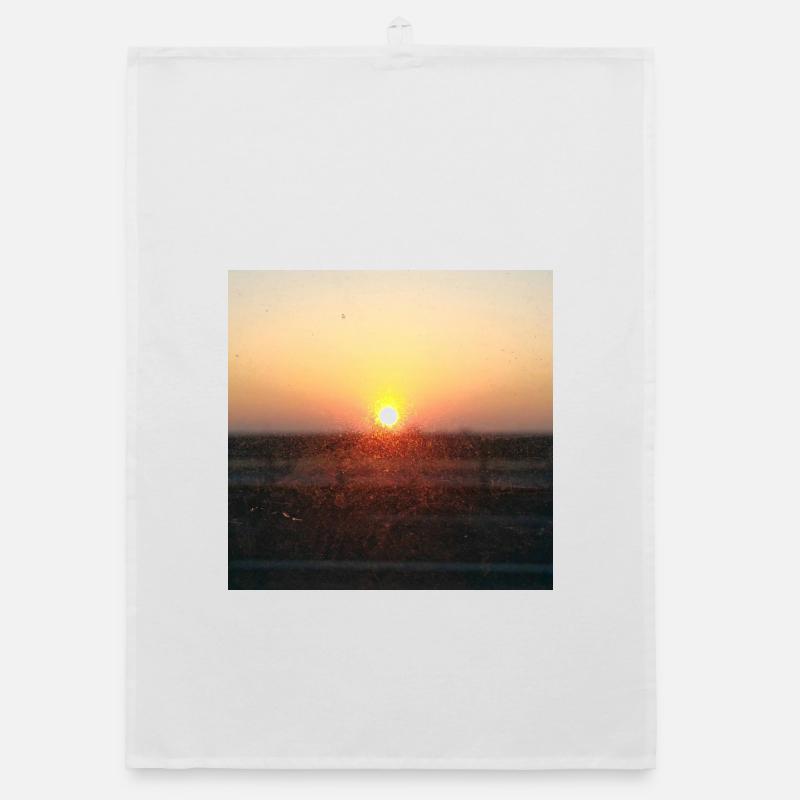 Rayon de coucher de soleil sur verre Torchon bio