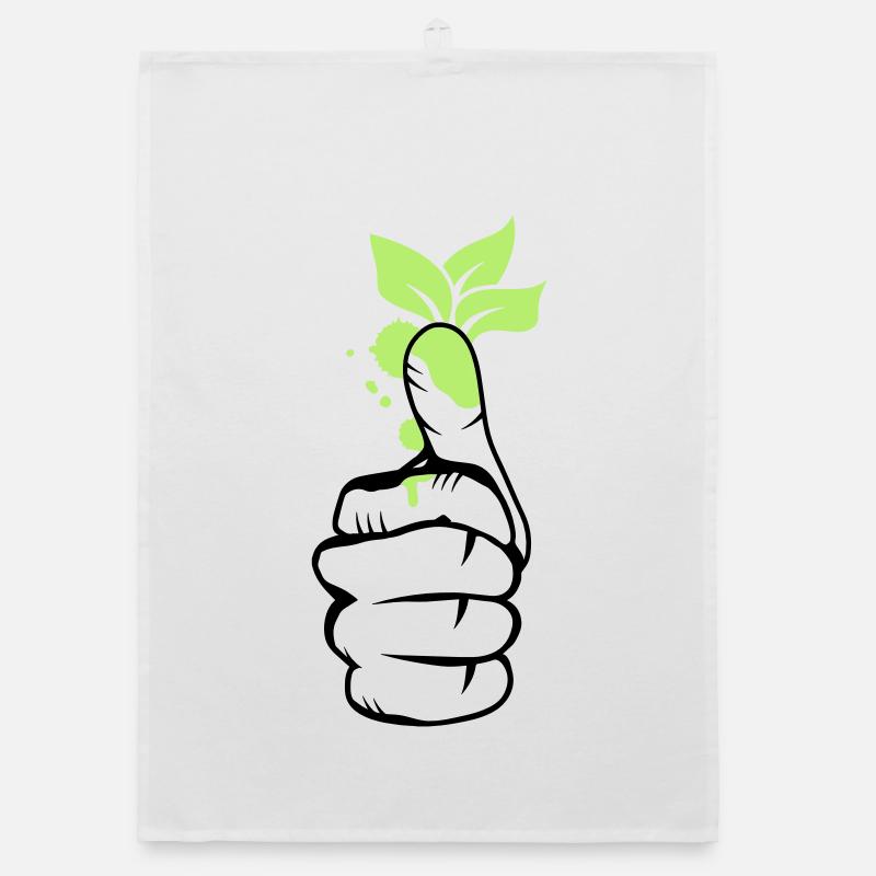 Une main avec des feuilles vertes sur le pouce Torchon bio