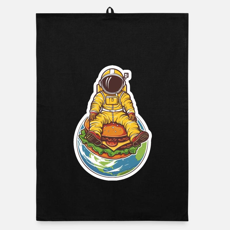Astronaute planant au-dessus de la terre avec un hamburger Torchon bio