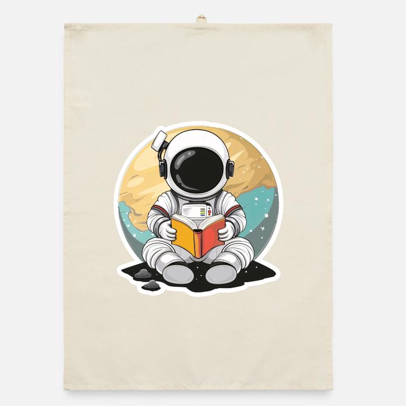 Astronaute dans l’espace devant une planète lisant un livre Torchon bio