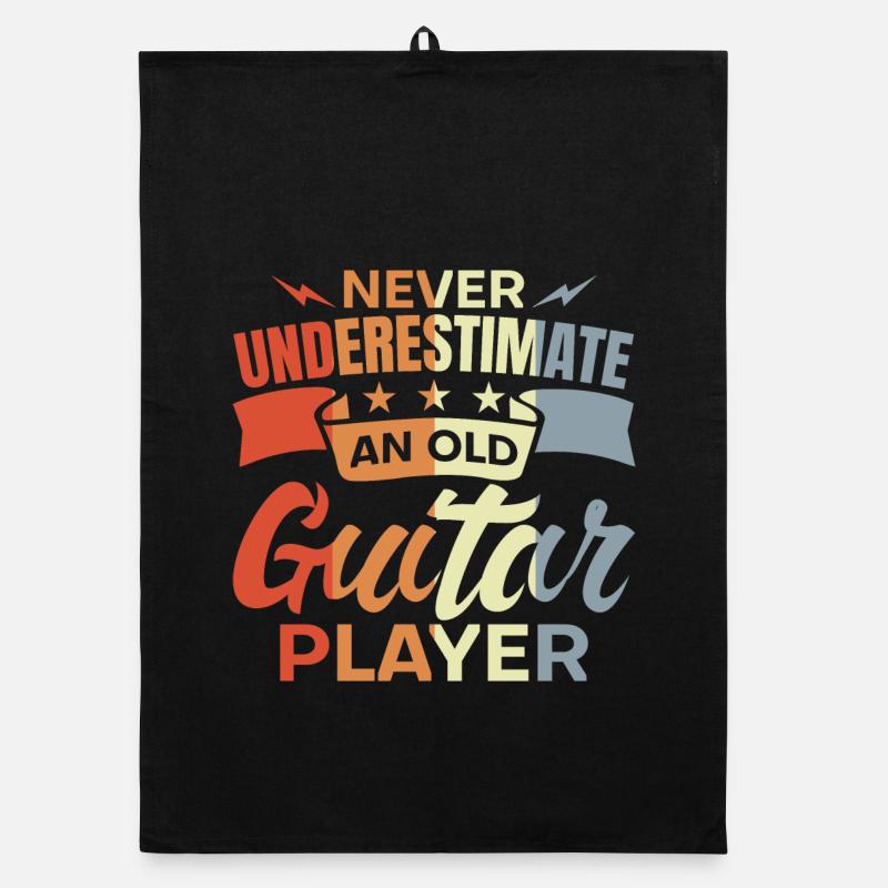 Ne sous-estimez jamais un vieux guitariste Torchon bio
