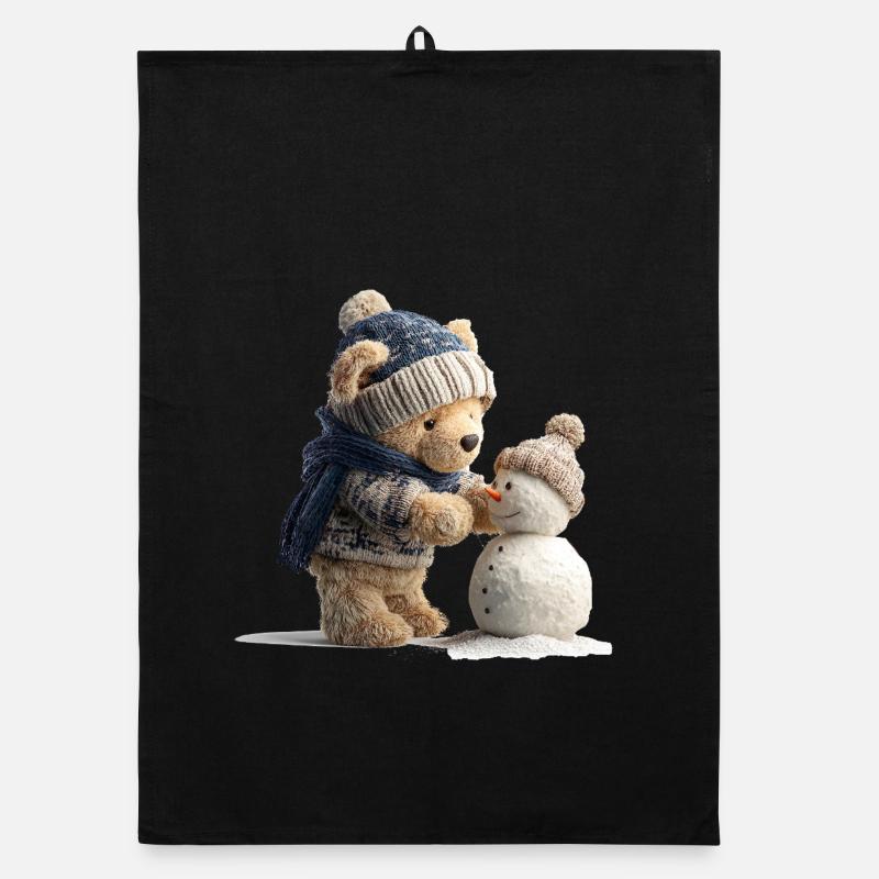 Teddy bear with hat and scarf builds snowman Organic dish towel