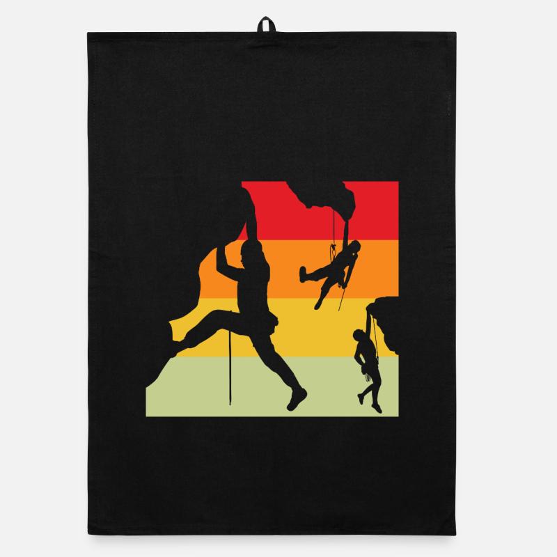 Silhouettes rétro des grimpeurs au coucher de soleil Torchon bio