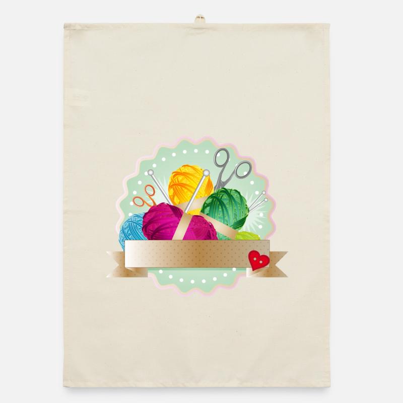 Balls of wool, button & knitting needles as a colorful patch Organic dish towel