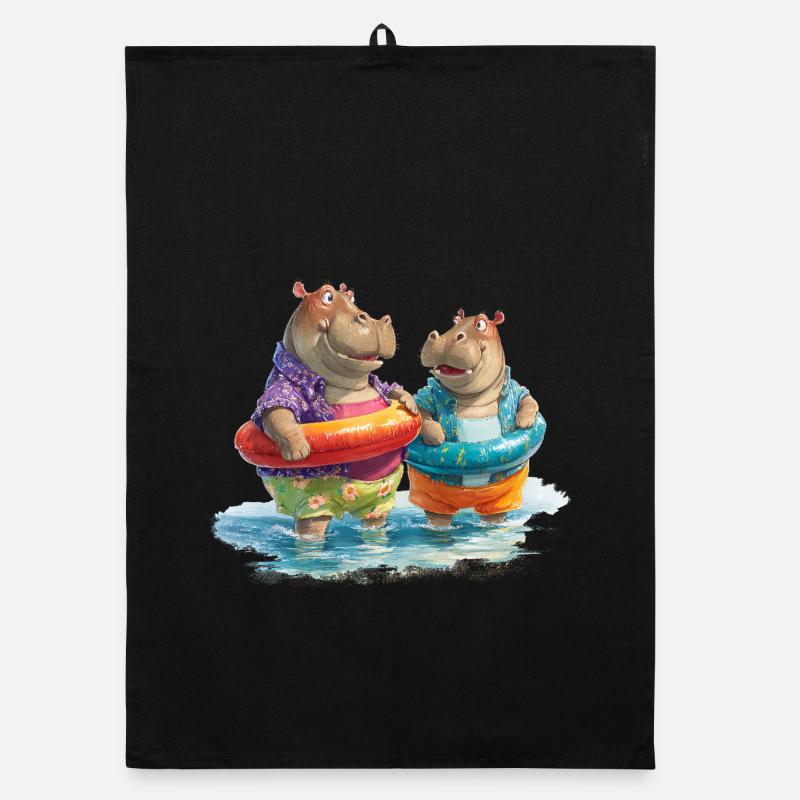 Hippopotames sur la plage avec des anneaux de nage Torchon bio