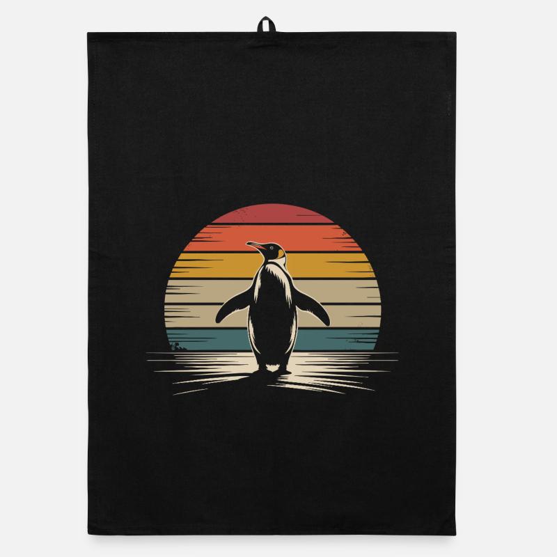 Silhouette de pingouin rétro avec fond de coucher de soleil Torchon bio