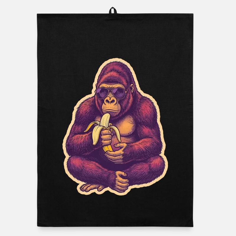 Gorille avec des lunettes de soleil mangeant une banane Torchon bio