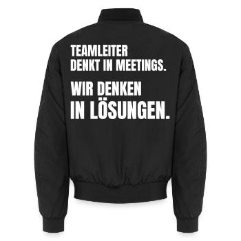 Teamleiter denkt in Meetings, Team denkt in Lösung - Unisex Bomberjacke - Schwarz - Hinten - AI Model Male 185 light (185cm)