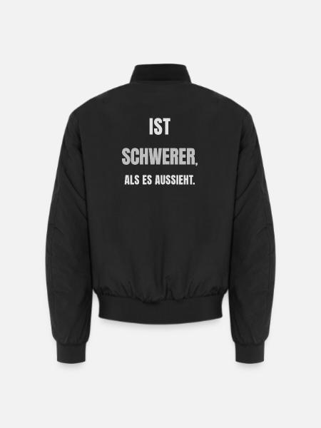 IST SCHWERER, ALS ES AUSSIEHT. – Helles Design - Unisex Bomberjacke - Schwarz