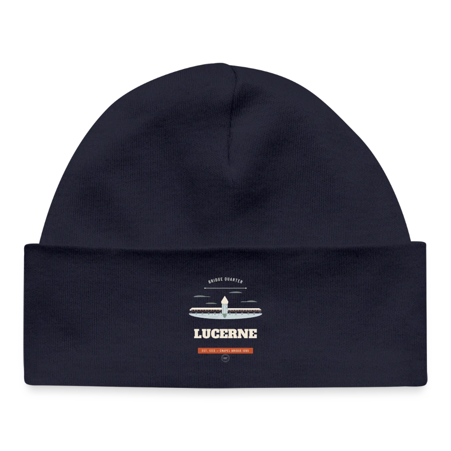 Lucerne badge on a baby organic beanie, navy
