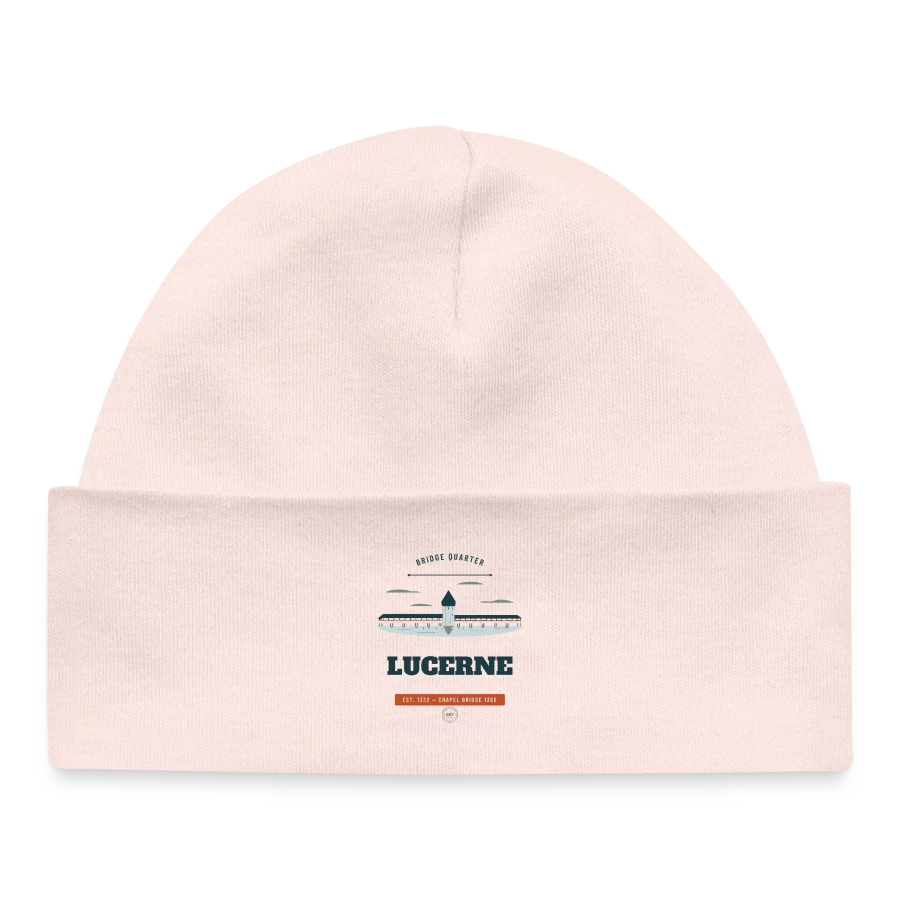 Lucerne badge on a baby organic beanie, pale pink