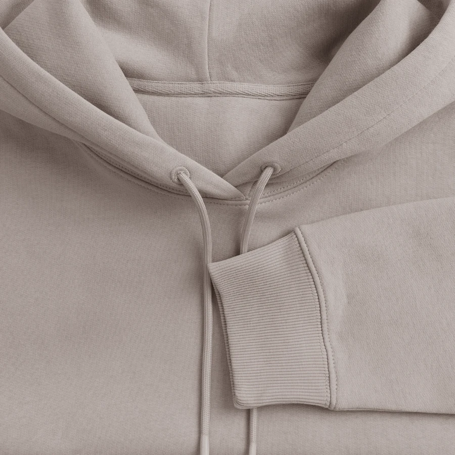 Salt Harbour badge on a women’s premium organic hoodie, taupe, close-up