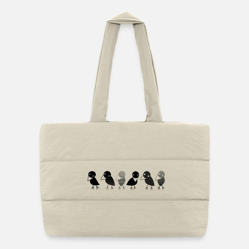 Les corbeaux en un coup d’œil. Corbeaux douillets sur une rangée Sac shopping matelassé