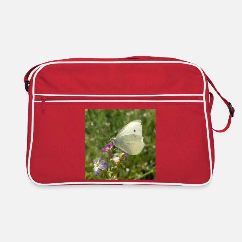 Papillon blanc sur fleur rose Sac Retro