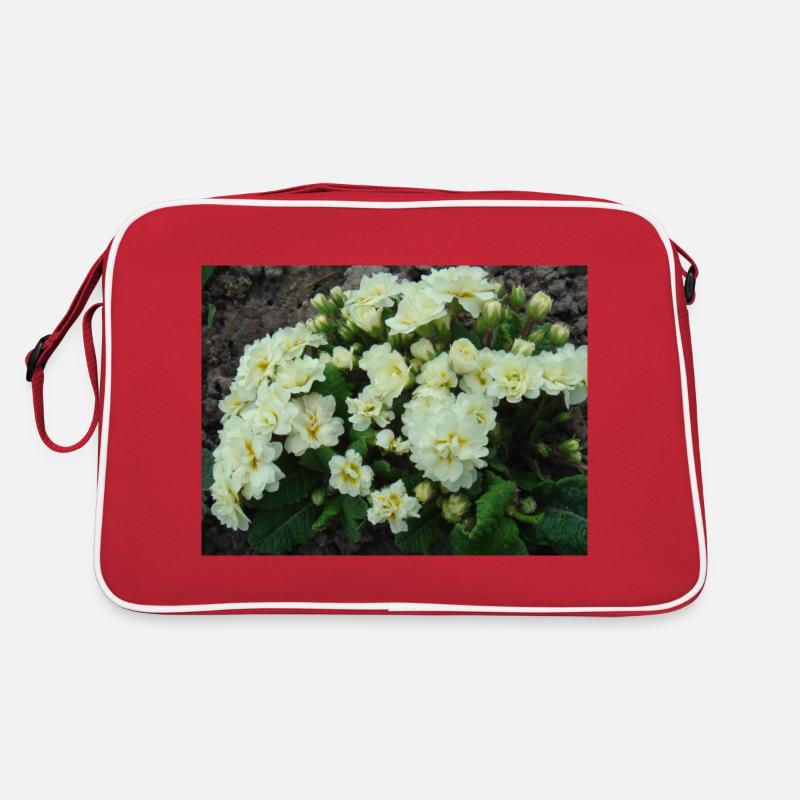 Weiße gefüllte Duftprimeln im Frühling Retro Tasche