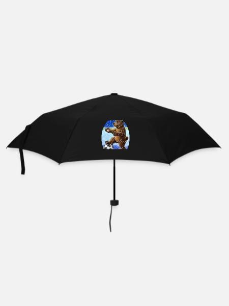 Un ours jouant au football sous la pluie - Parapluie standard - noir