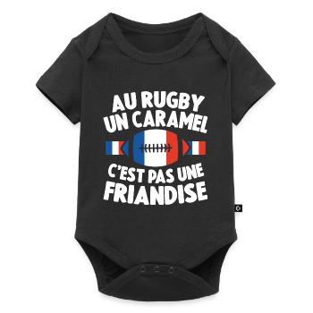 Au Rugby Un Caramel C'est Pas Une Friandise Cadeau - Body à manches courtes Premium Bébé - noir - Devant