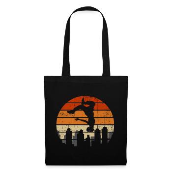 Sonnenuntergangsakrobat über der Skyline der Stadt - Stoffbeutel - Schwarz - Vorne