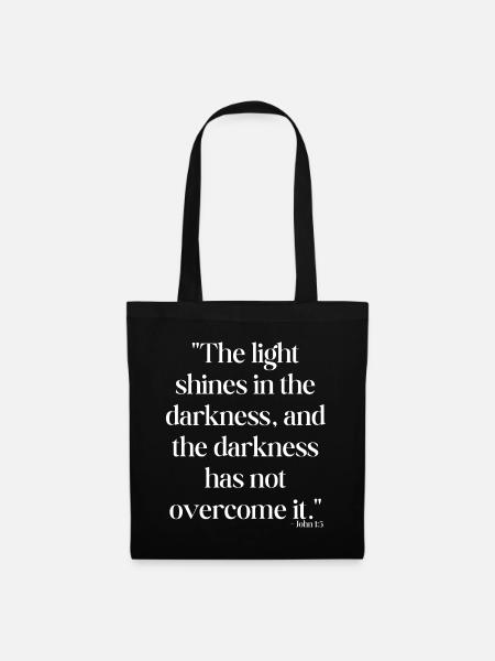 The light shines in the darkness... - Tote Bag - black