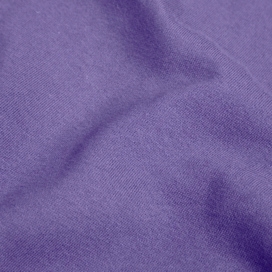 Mount Olympus badge on a unisex sweatshirt, lavender, close-up