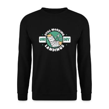 Ich arbeite immer noch an meinen Landungen, gebrochener Fingerknochen - Unisex Pullover - Schwarz - Vorne - Alina (178cm) & Michal (187cm)