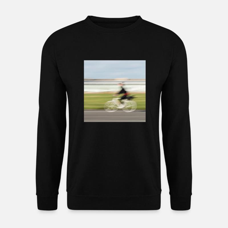 Radfahrerin in Bewegung auf einer geraden Asphaltstraße - Unisex Pullover - Schwarz