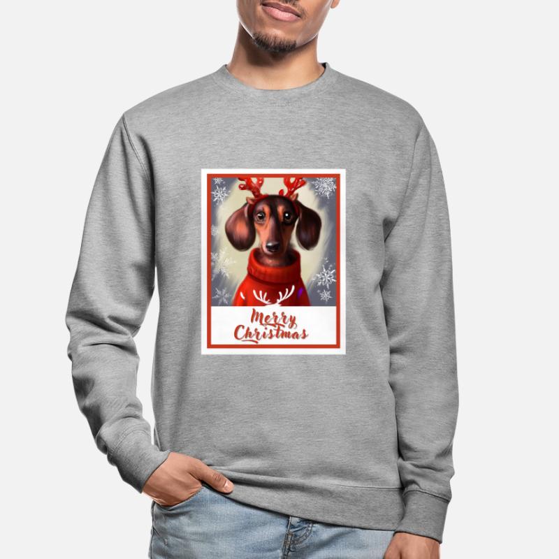 Doux chien heureux teckel dans un pull de Noël. Sweat-shirt Unisexe