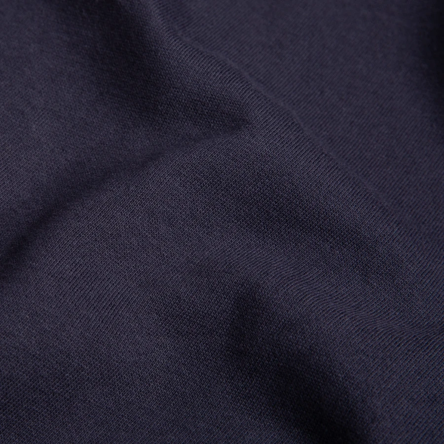 Moon Bay badge on a unisex sweatshirt, navy, close-up