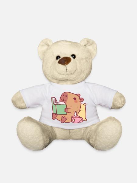 Niedliche Capybara entspannt und liest ein Buch - Teddy - Weiß