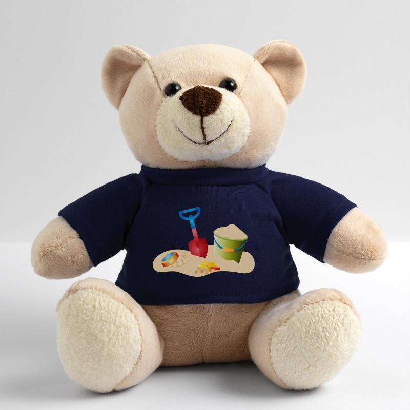 Jouets de sable sur la plage ou dans le bac à sable Nounours