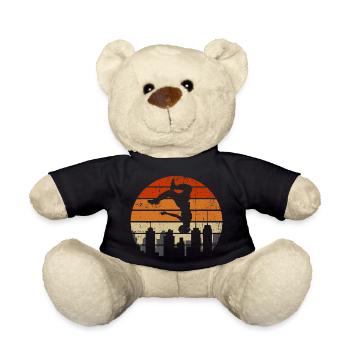 Sonnenuntergangsakrobat über der Skyline der Stadt - Teddy - Schwarz - Vorne