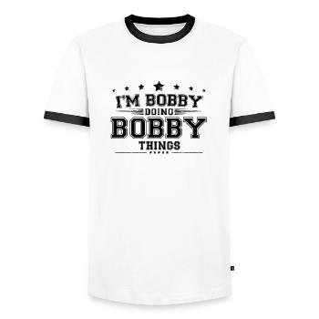 i’m Bobby doing Bobby things - Men's Ringer Shirt - white/black - Front - AI Model Female 172 light (172cm) & AI Model Male 178 dark (178cm)