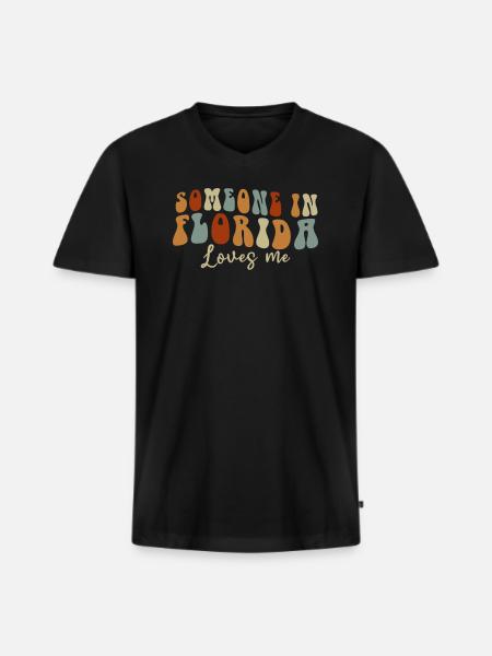 Quelqu’un en Floride m’aime - T-shirt encolure en V Premium bio Homme - noir