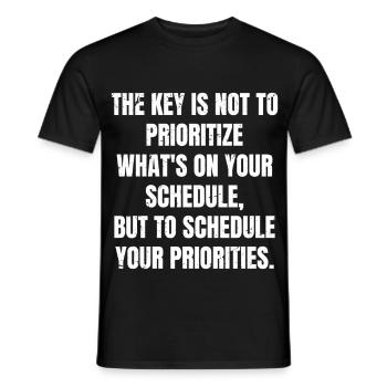 the key is not to prioritize what's on your schedu - Men's T-Shirt - black - Front - AI Model Male 178 light (178cm)