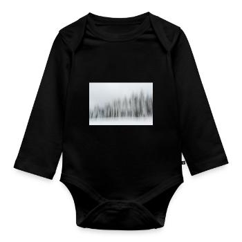 A row of snowy conifers in a winter landscape in m - Organic Longsleeve Baby Bodysuit - black - Front