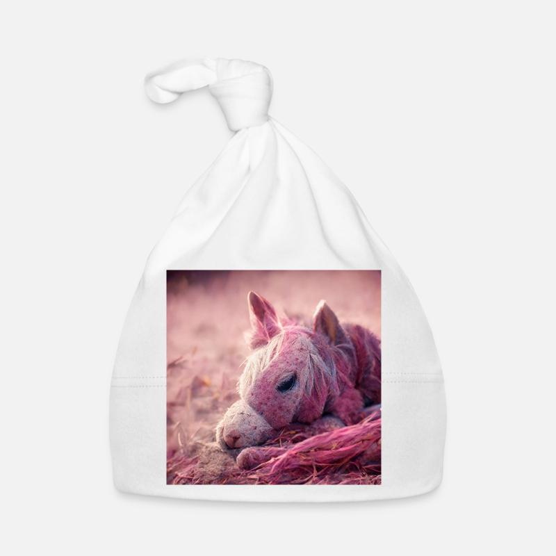 Bébé cheval allongé sur le sol Rose - Bonnet bio Bébé - blanc